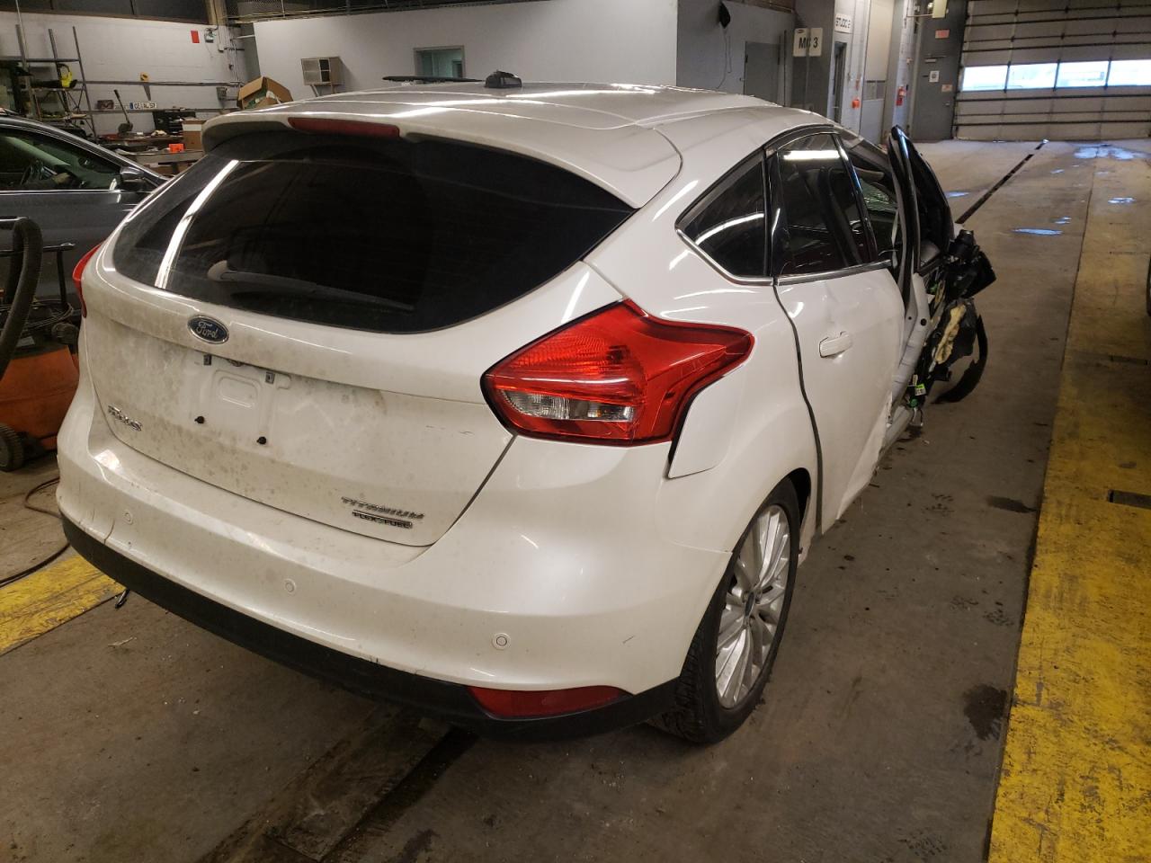 Photo 4 from auction – 2015 FORD FOCUS TITA with VIN 1FADP3N22FL309183
