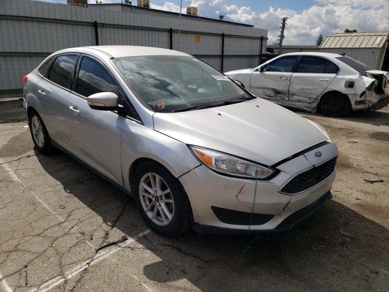 FORD FOCUS SE 2016 with VIN 1FADP3F20GL289872 - Photo from auction