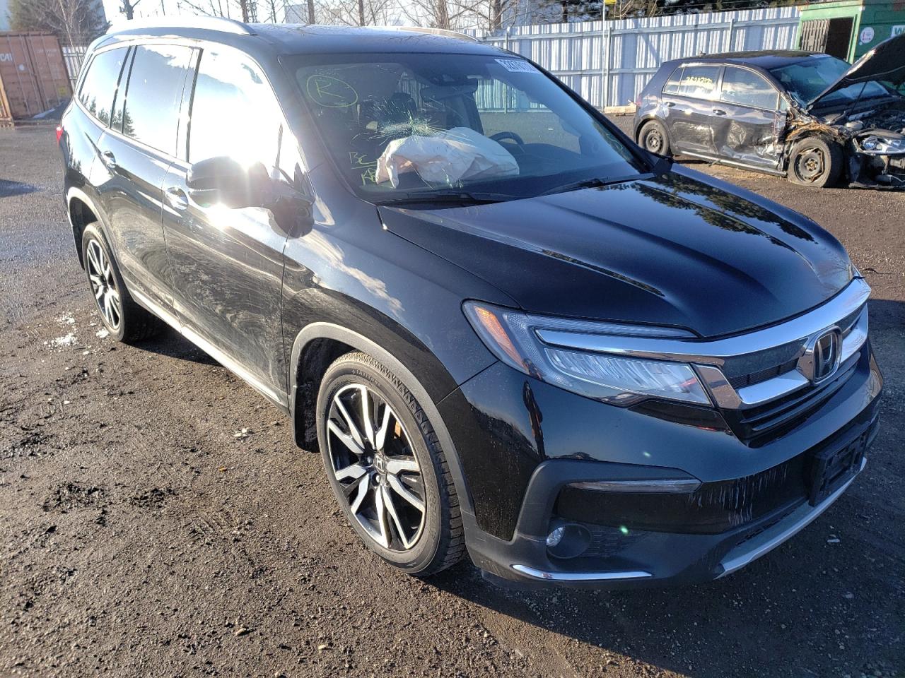 HONDA PILOT TOUR 2019 with VIN 5FNYF6H64KB503306 - Photo from auction