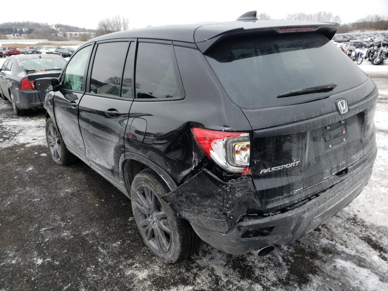 Photo 3 from auction – 2021 HONDA PASSPORT E with VIN 5FNYF8H5XMB042182