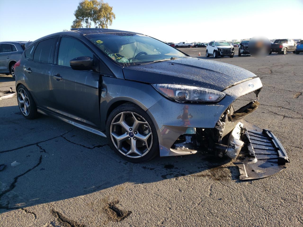 FORD FOCUS ST 2018 with VIN 1FADP3L99JL288034 - Photo from auction