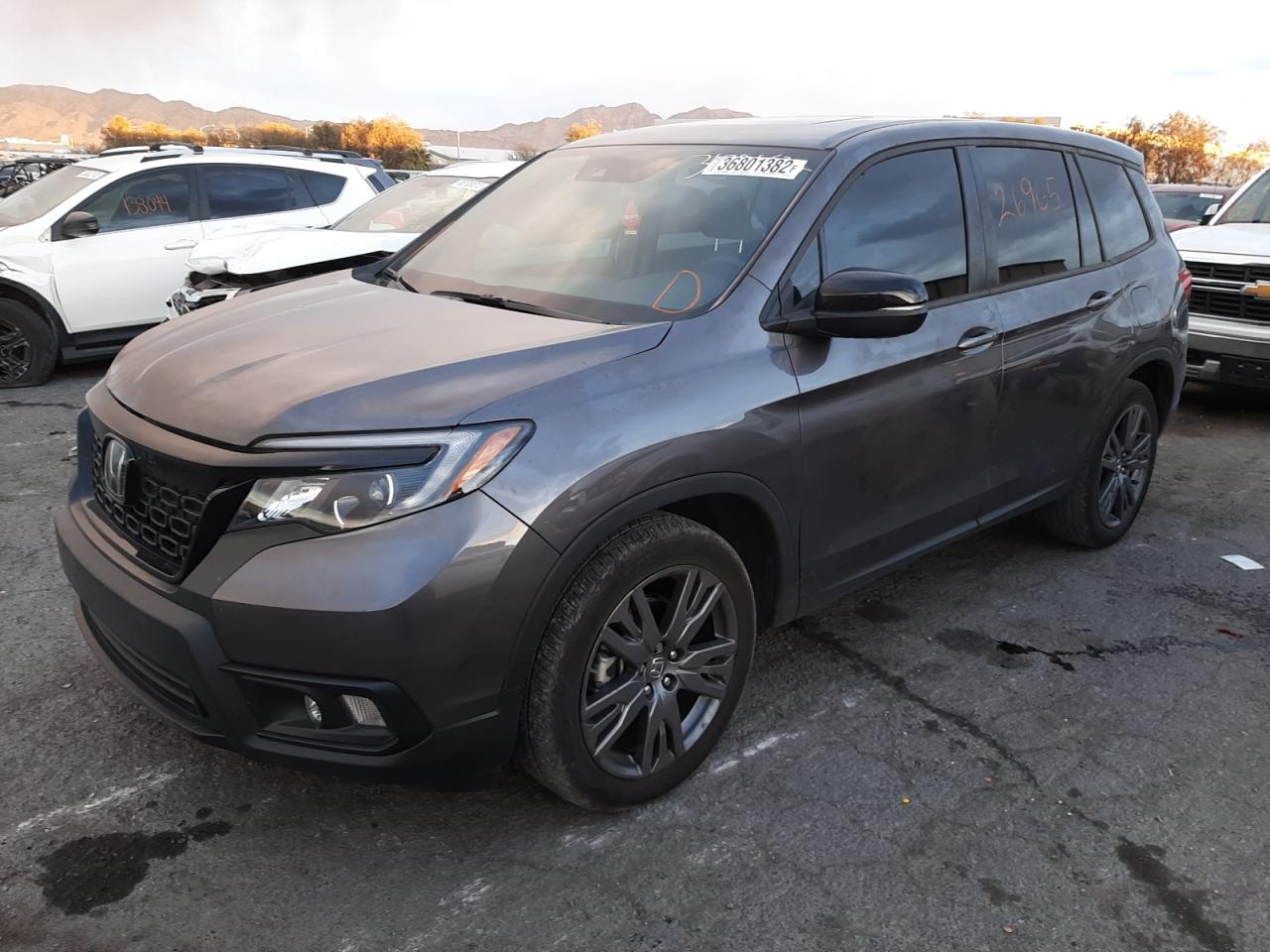 Photo 2 from auction – 2021 HONDA PASSPORT E with VIN 5FNYF7H5XMB001965