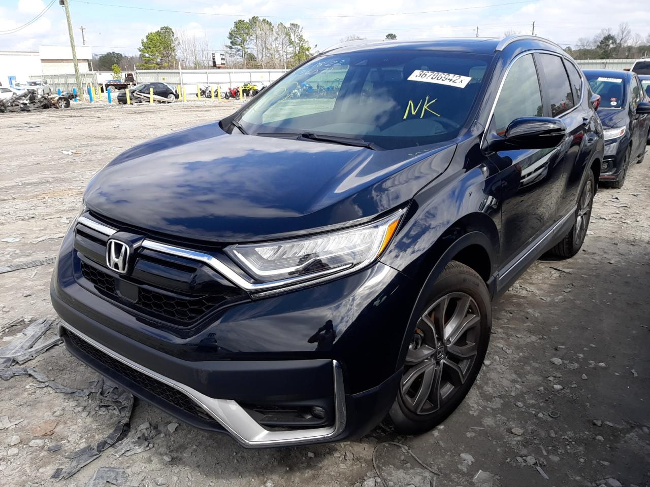 Photo 2 from auction – 2021 HONDA CRV with VIN 5J6RW1H90ML001937