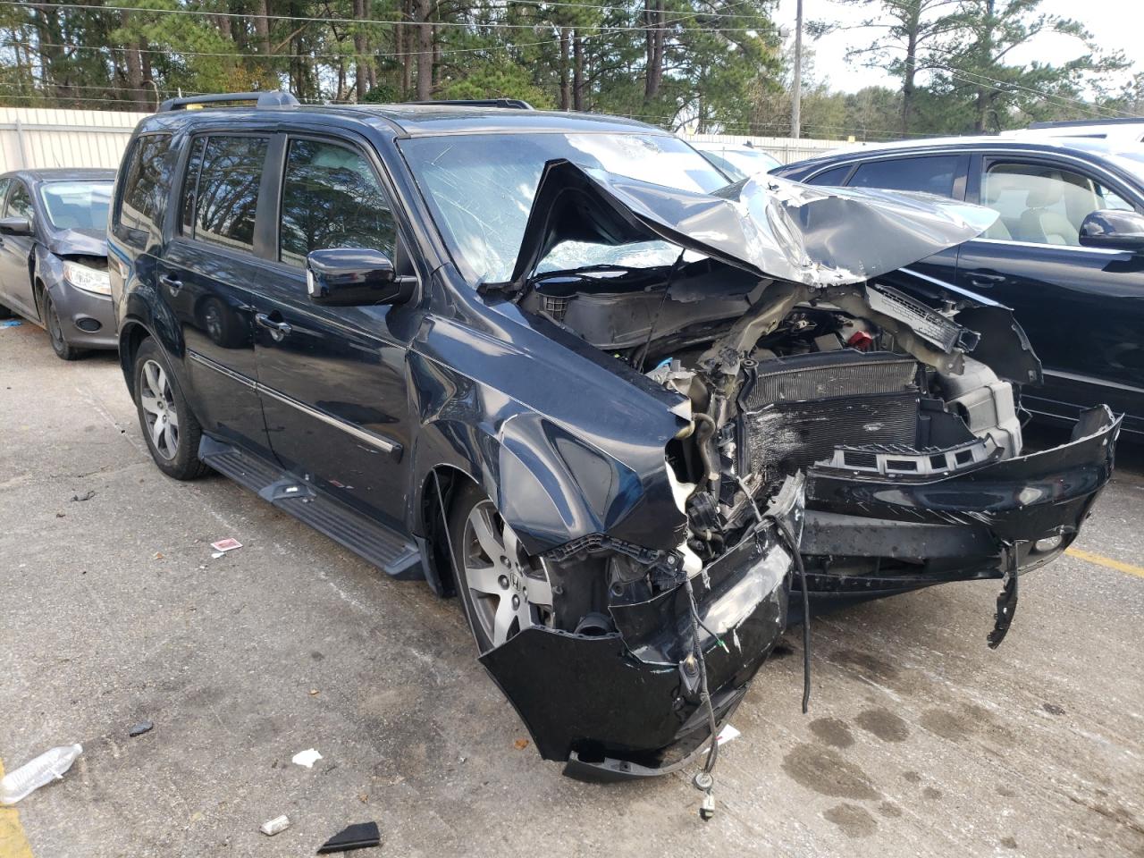 HONDA PILOT TOUR 2012 with VIN 5FNYF4H99CB052115 - Photo from auction