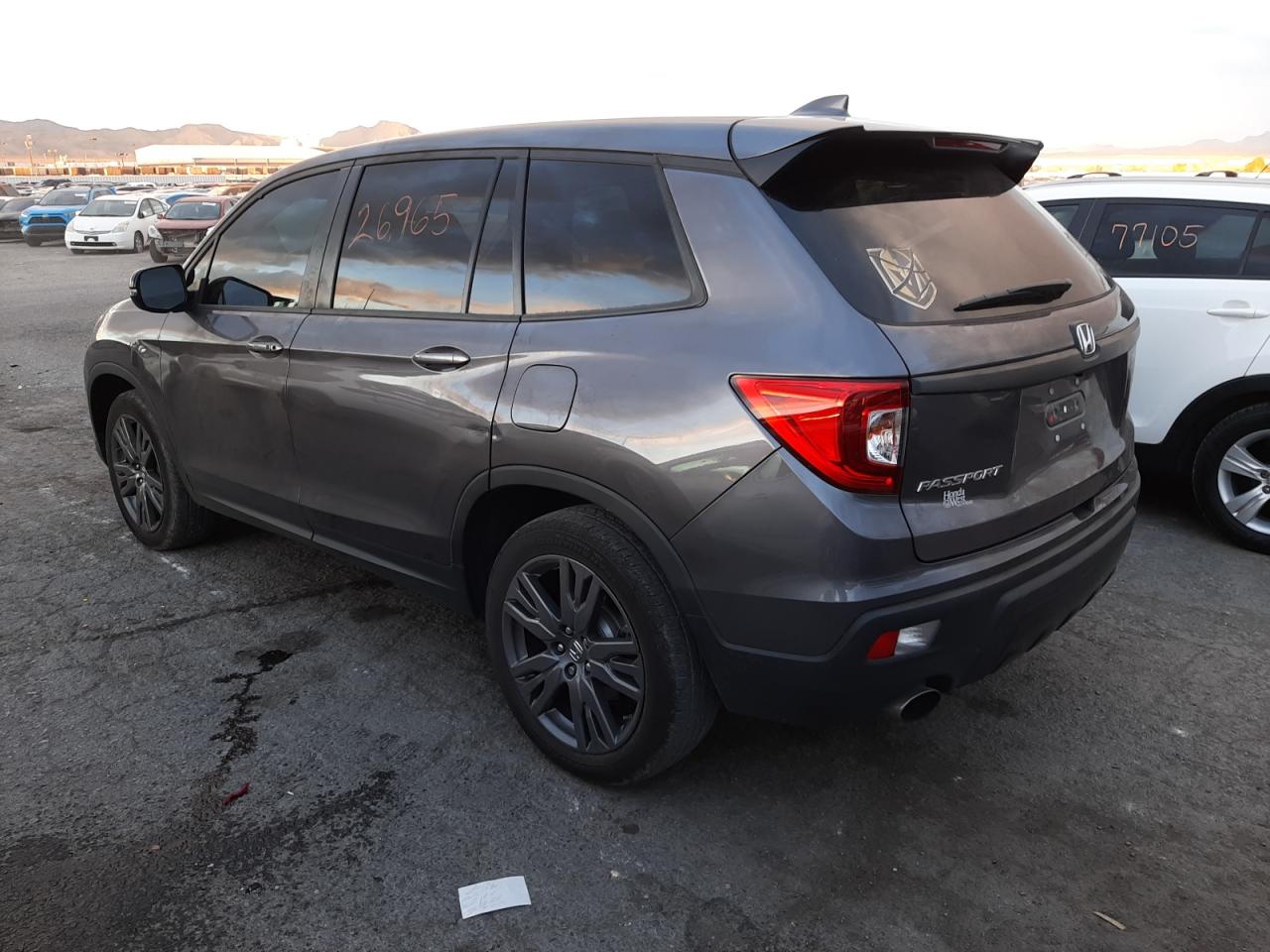 Photo 3 from auction – 2021 HONDA PASSPORT E with VIN 5FNYF7H5XMB001965