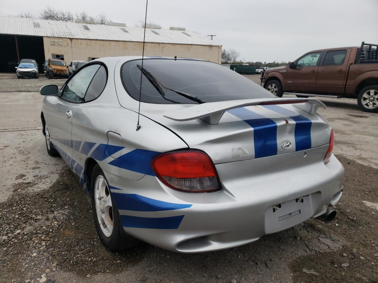 Photo 3 from auction – 2001 HYUNDAI TIBURON with VIN KMHJG35F41U265945