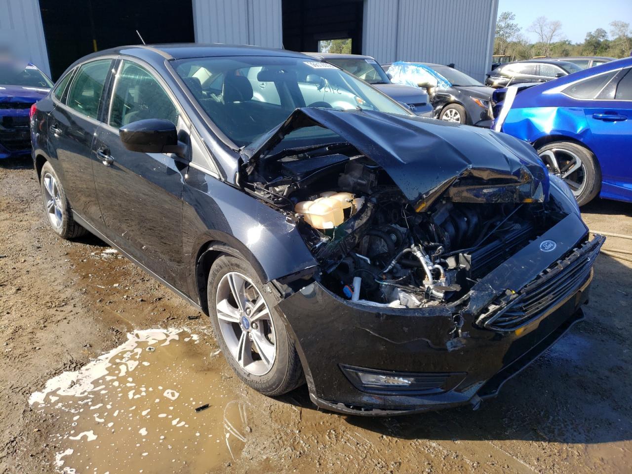 FORD FOCUS SE 2018 with VIN 1FADP3F29JL306403 - Photo from auction