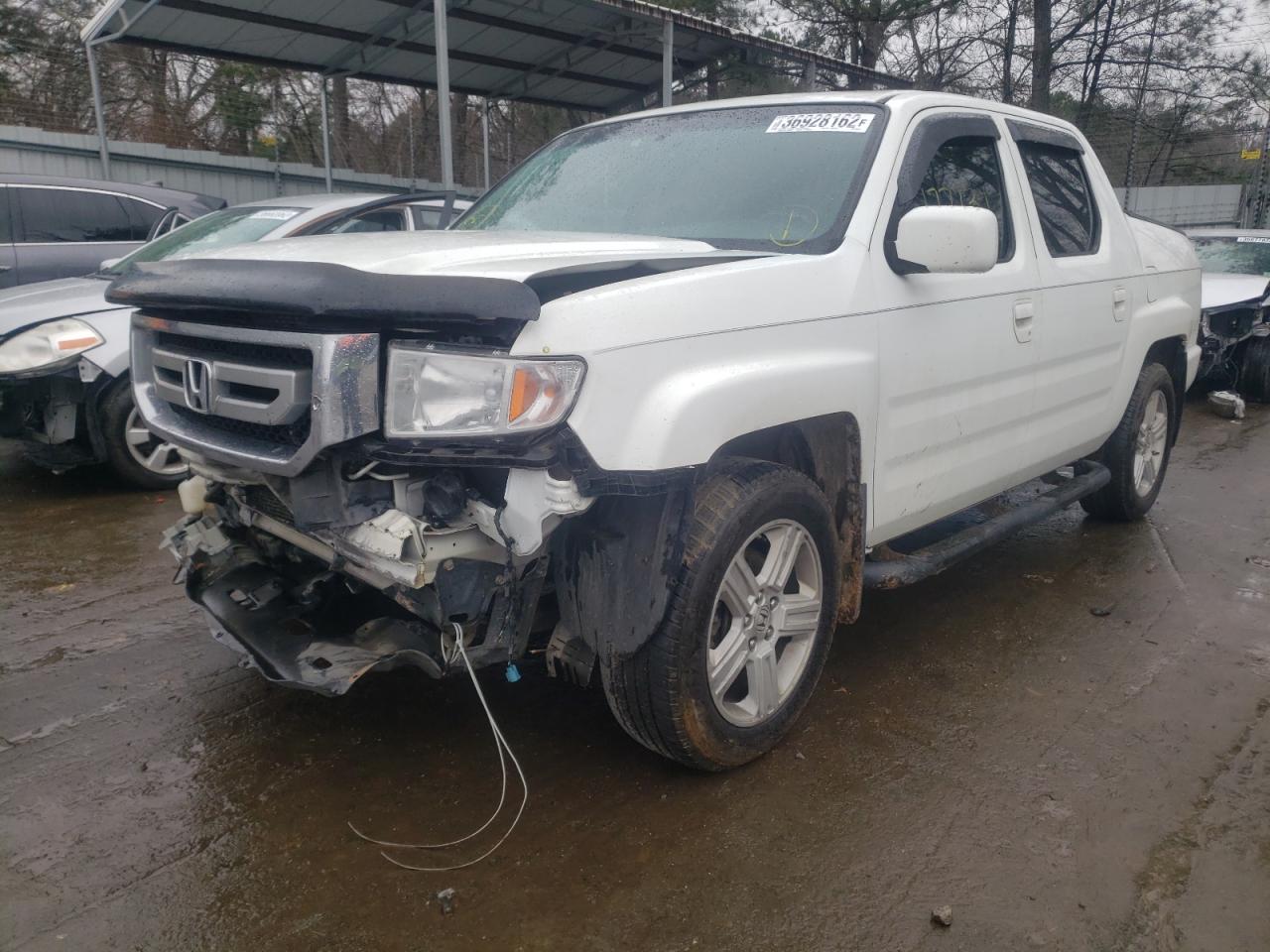 Photo 2 from auction – 2011 HONDA RIDGELINE with VIN 5FPYK1F53BB006148