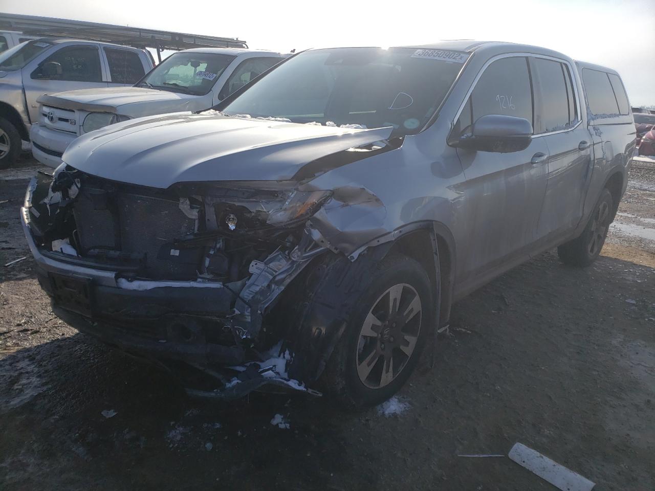 Photo 2 from auction – 2020 HONDA RIDGELINE with VIN 5FPYK3F55LB029282
