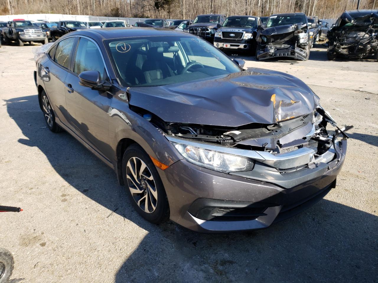HONDA CIVIC EX 2018 with VIN 19XFC2F72JE041269 - Photo from auction