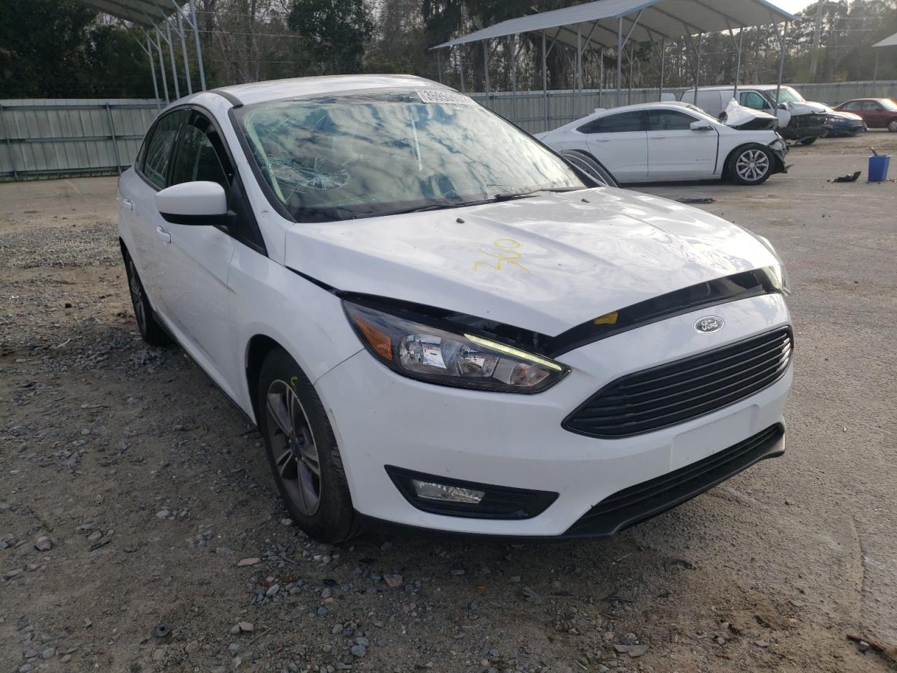 FORD FOCUS SE 2018 with VIN 1FADP3FE6JL201893 - Photo from auction