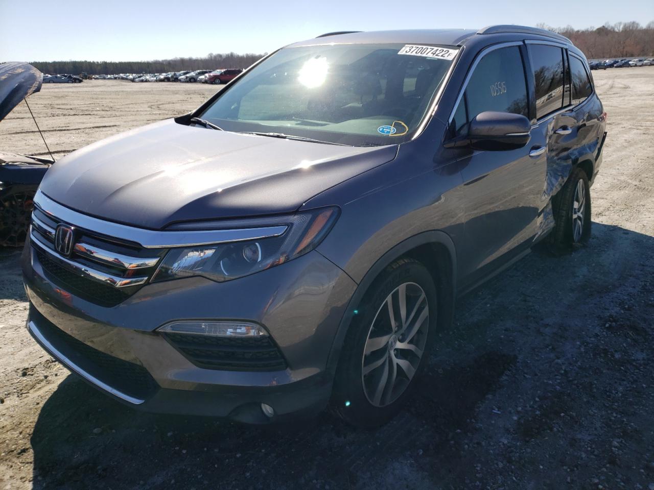 Photo 2 from auction – 2016 HONDA PILOT ELIT with VIN 5FNYF6H01GB101312