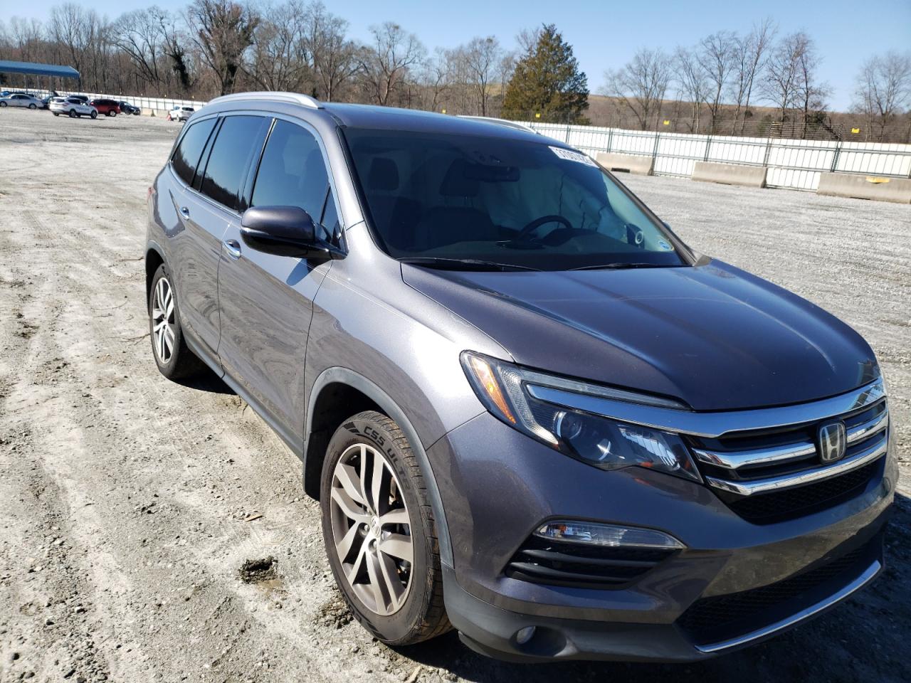 HONDA PILOT ELIT 2016 with VIN 5FNYF6H01GB101312 - Photo from auction
