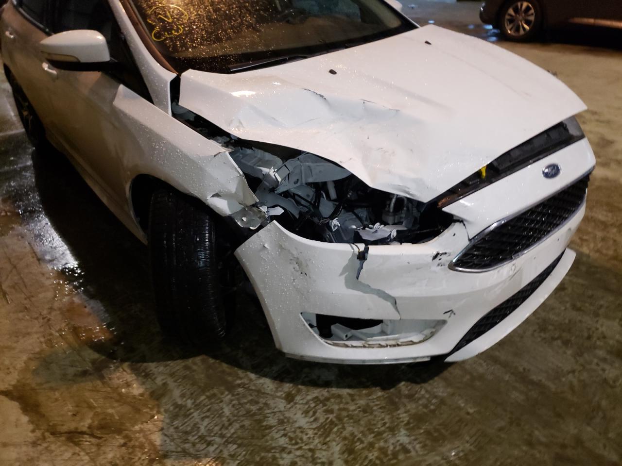Photo 9 from auction – 2018 FORD FOCUS SE with VIN 1FADP3K25JL297057