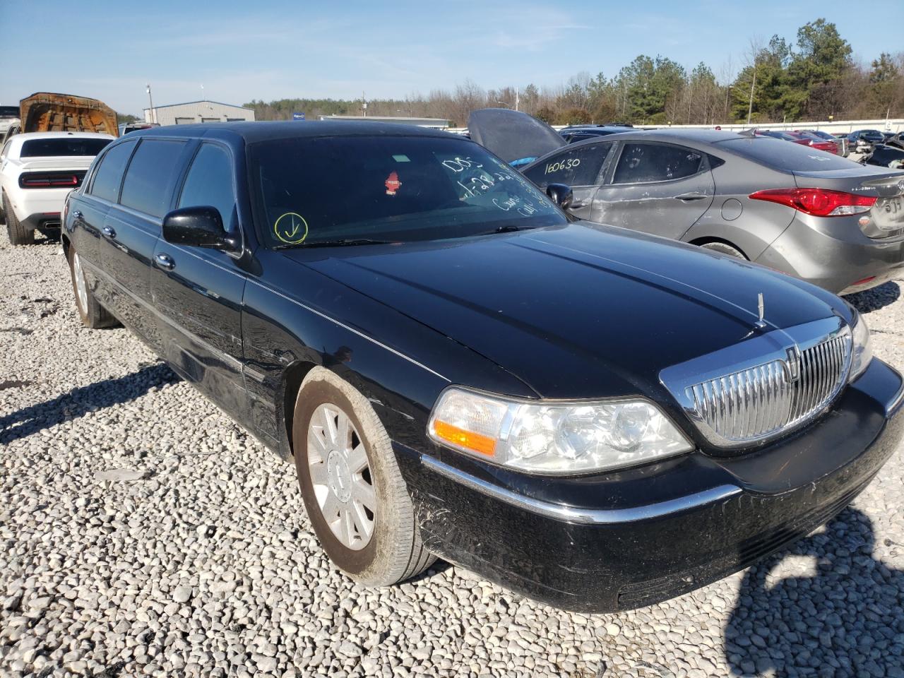 Photo 9 from auction – 2003 LINCOLN TOWN CAR E with VIN 1L1FM81W33Y701330