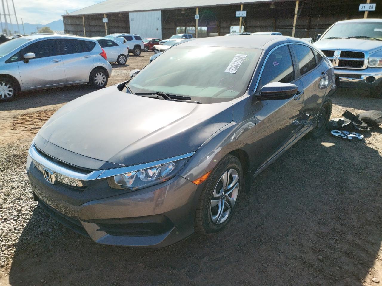 Photo 2 from auction – 2018 HONDA CIVIC LX with VIN 19XFC2F52JE012238