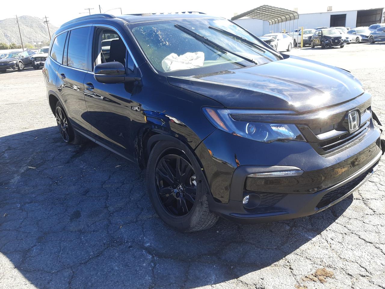 HONDA PILOT SE 2021 with VIN 5FNYF5H27MB022637 - Photo from auction
