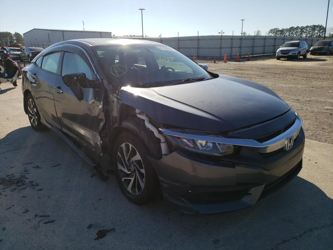 HONDA CIVIC EX 2018 with VIN 2HGFC2F7XJH596296 - Photo from auction