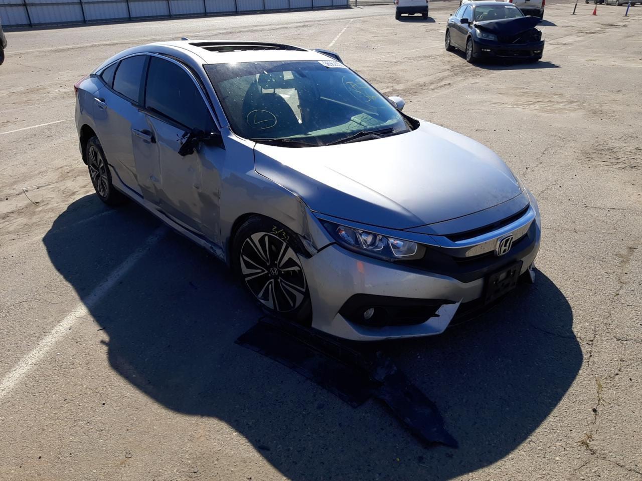 HONDA CIVIC EX 2018 with VIN JHMFC1F33JX016094 - Photo from auction