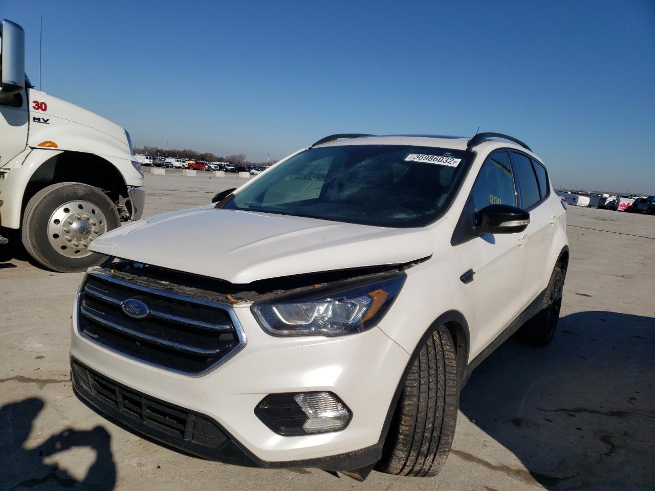 Photo 2 from auction – 2017 FORD ESCAPE TIT with VIN 1FMCU9J96HUB51539