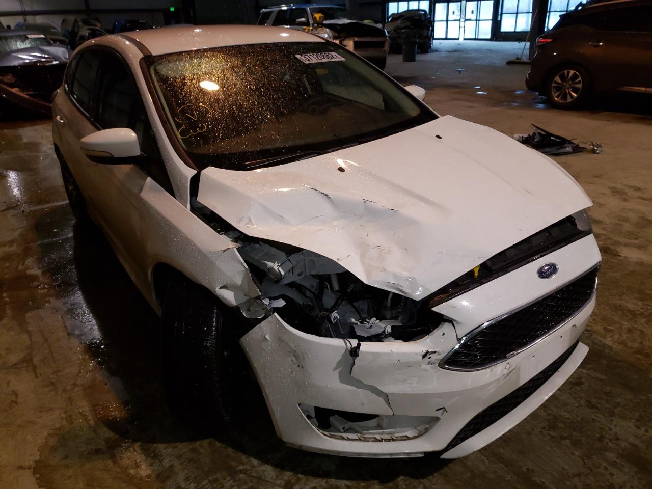 FORD FOCUS SE 2018 with VIN 1FADP3K25JL297057 - Photo from auction