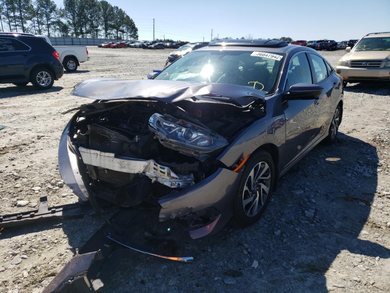Photo 2 from auction – 2018 HONDA CIVIC EX with VIN 19XFC2F71JE019568