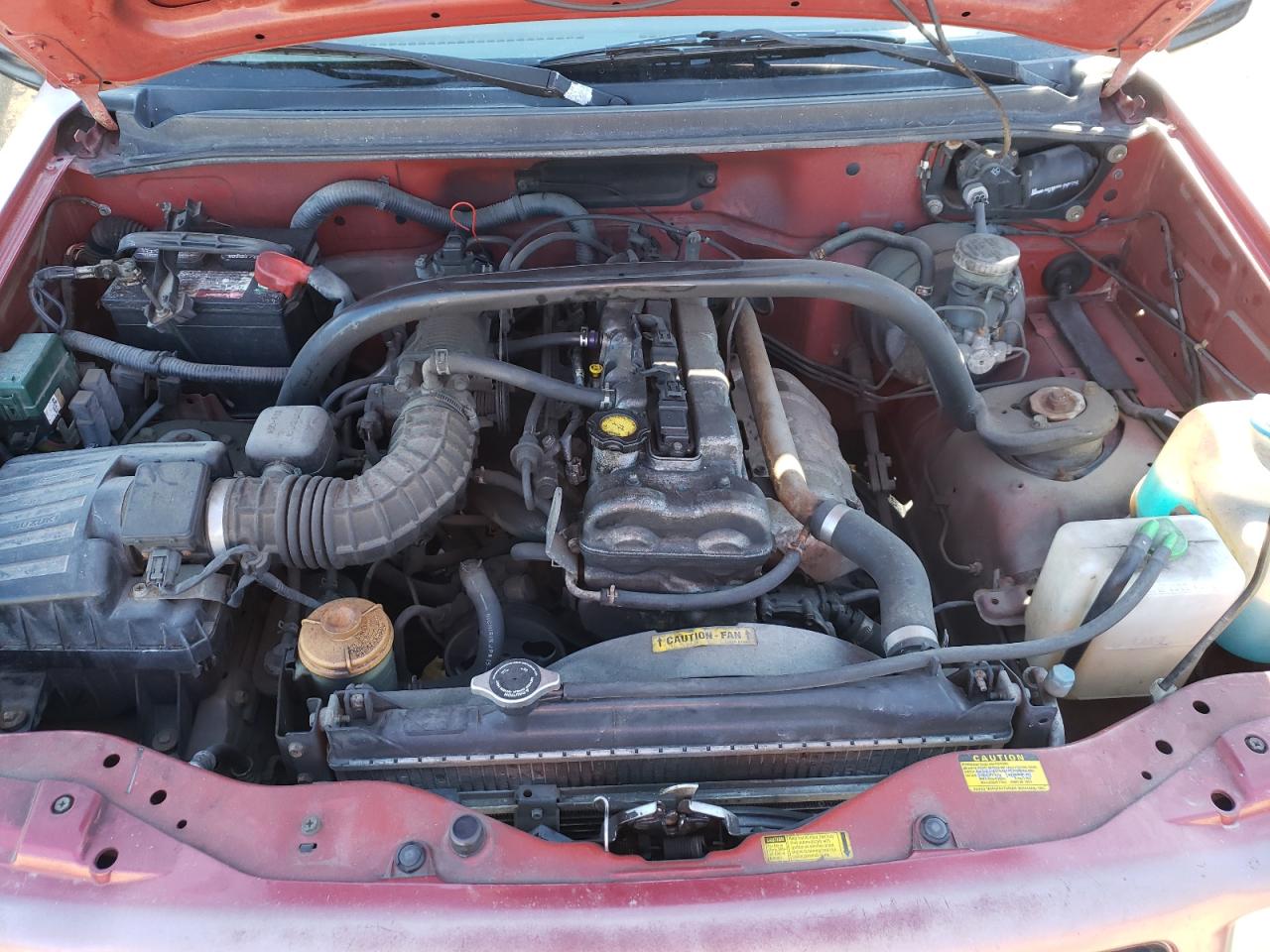 Photo 7 from auction – 2000 CHEVROLET TRACKER with VIN 2CNBE13C1Y6933913
