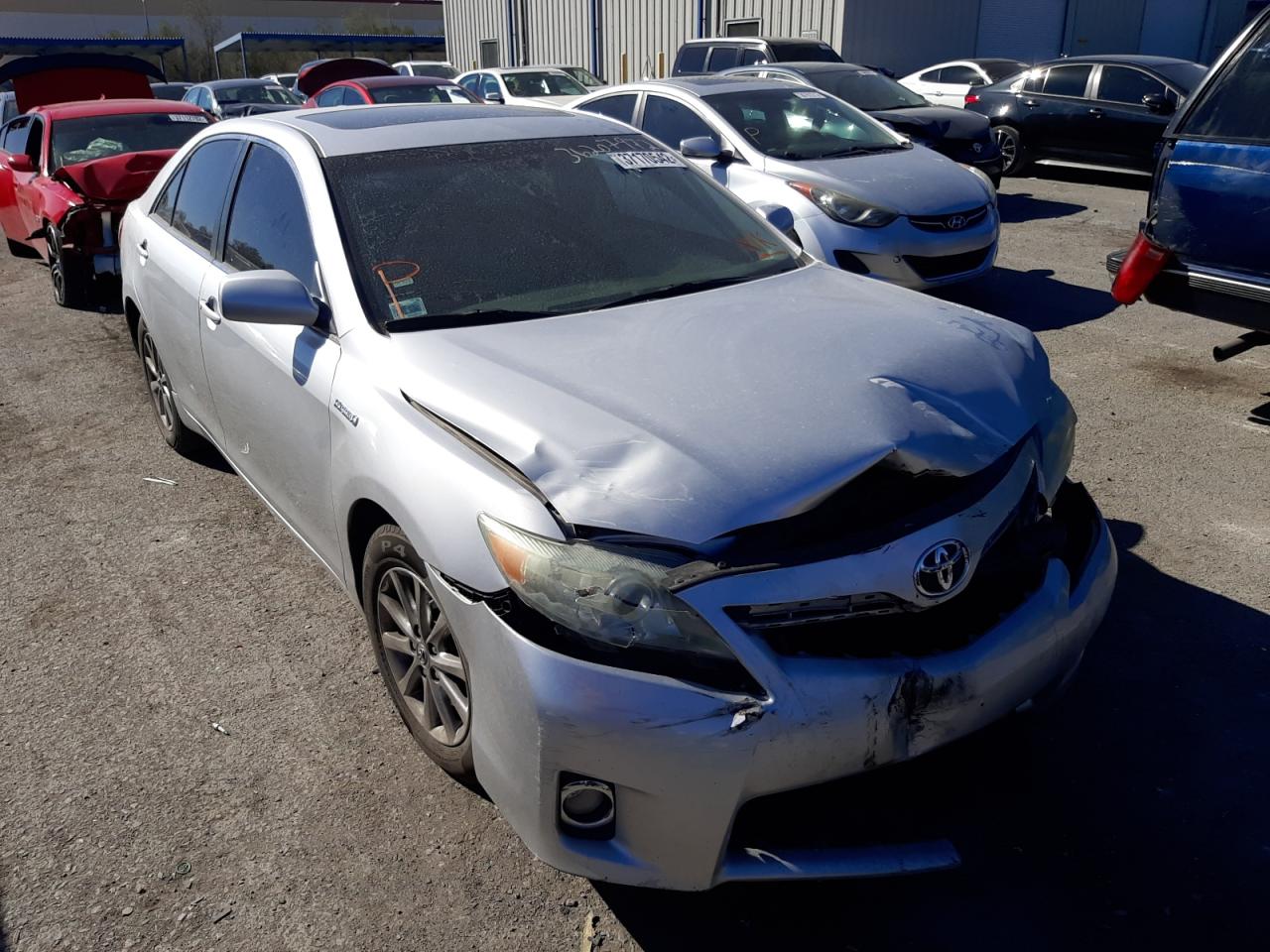 TOYOTA CAMRY HYBR 2011 with VIN 4T1BB3EK4BU129865 - Photo from auction