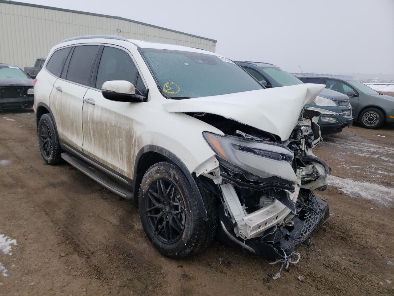 HONDA PILOT TOUR 2019 with VIN 5FNYF6H90KB500820 - Photo from auction