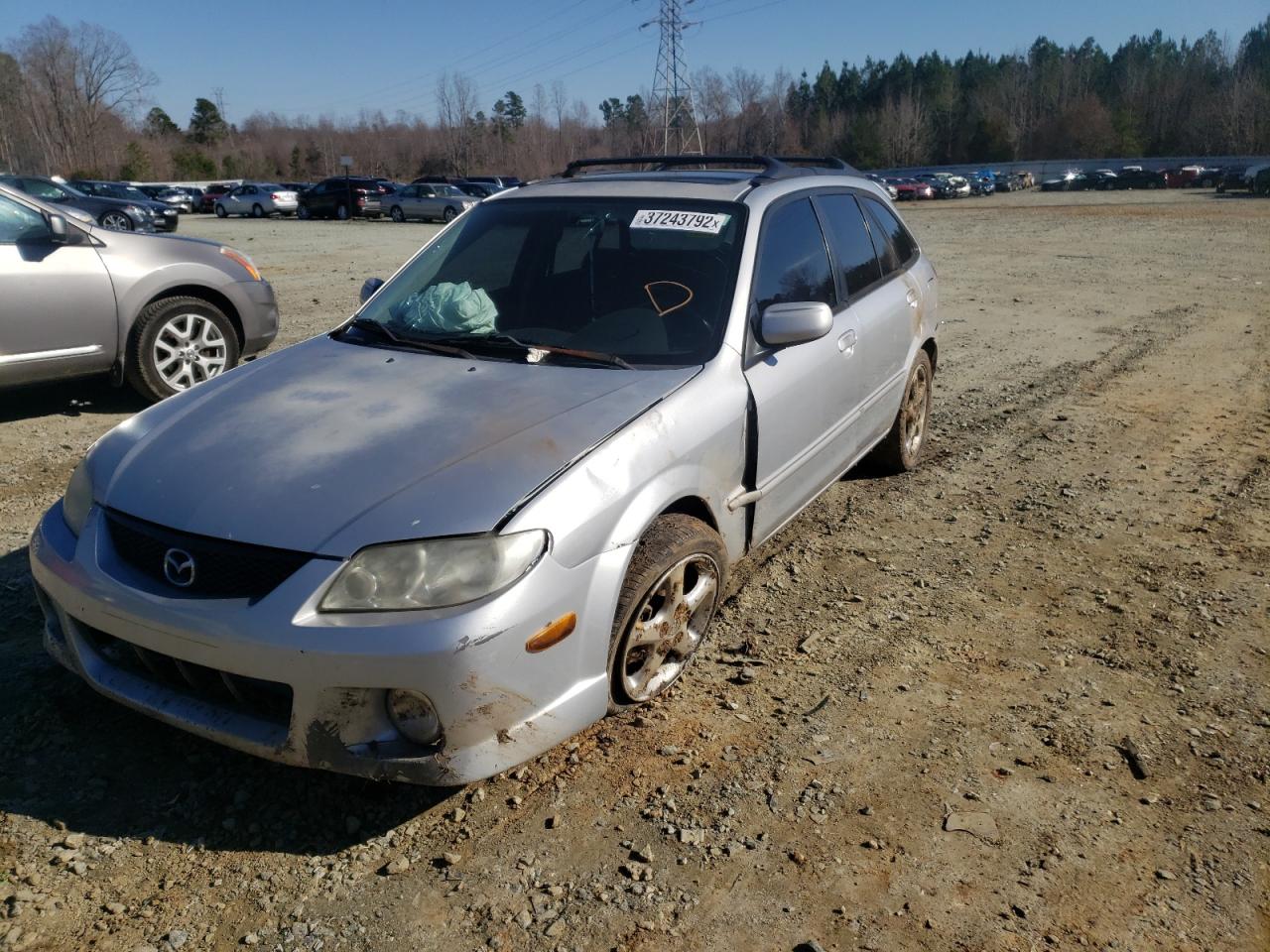 Photo 2 from auction – 2002 MAZDA PROTEGE PR with VIN JM1BJ245421468348