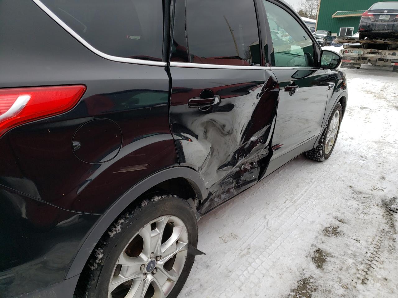Photo 9 from auction – 2016 FORD ESCAPE TIT with VIN 1FMCU9J92GUC83602