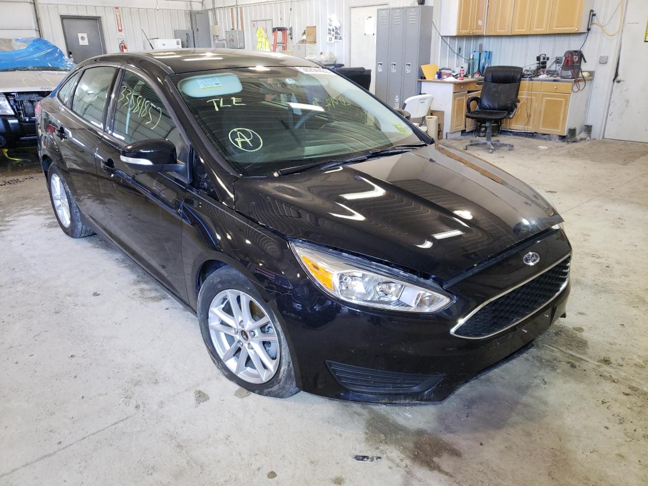 FORD FOCUS SE 2016 with VIN 1FADP3F23GL310150 - Photo from auction