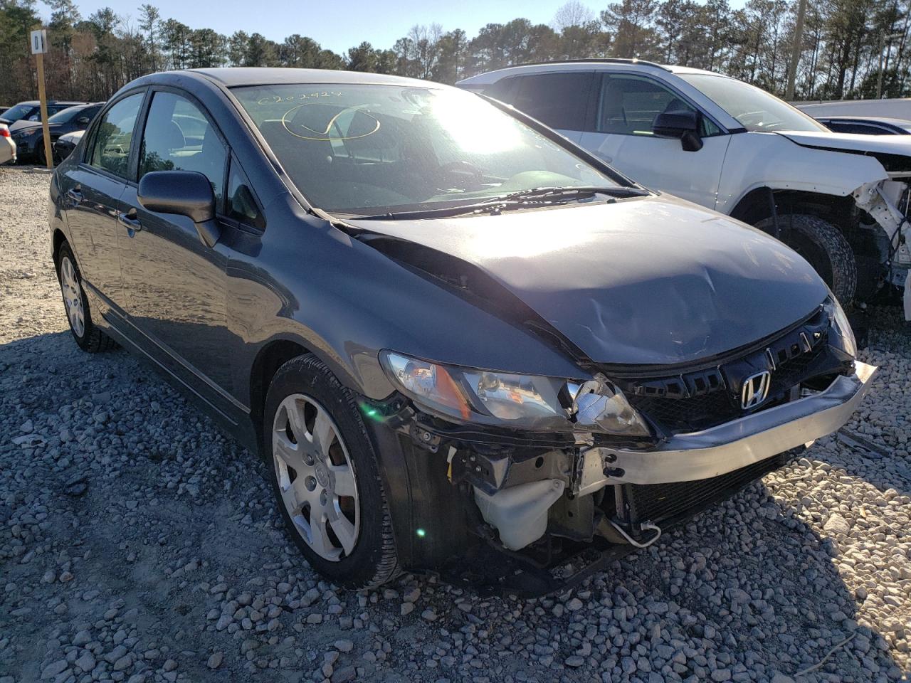 HONDA CIVIC LX 2011 with VIN 19XFA1F50BE033641 - Photo from auction