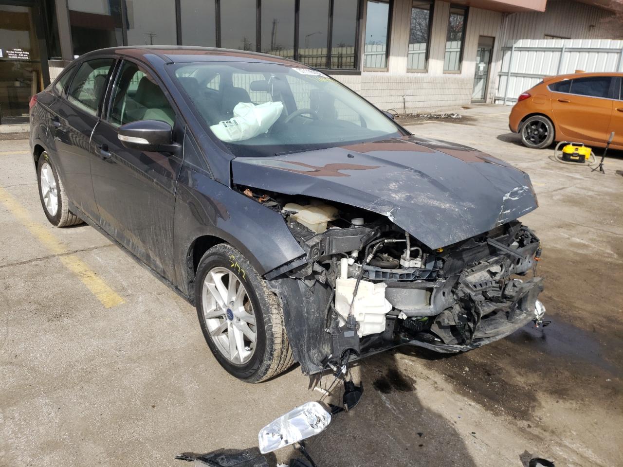 FORD FOCUS SE 2017 with VIN 1FADP3F24HL212973 - Photo from auction
