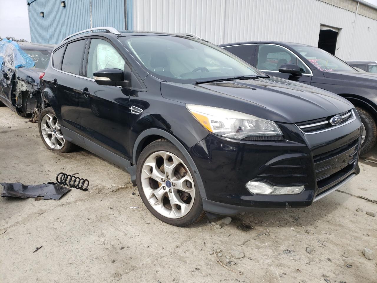 FORD ESCAPE TIT 2016 with VIN 1FMCU9JX0GUA01584 - Photo from auction