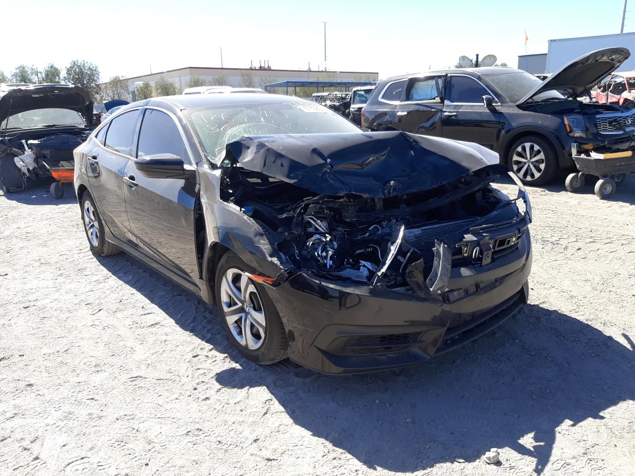 HONDA CIVIC LX 2018 with VIN 19XFC2F51JE010674 - Photo from auction