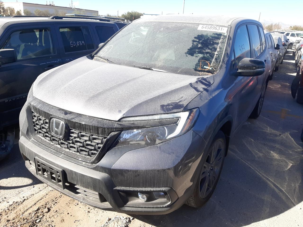 Photo 2 from auction – 2020 HONDA PASSPORT E with VIN 5FNYF7H54LB003984