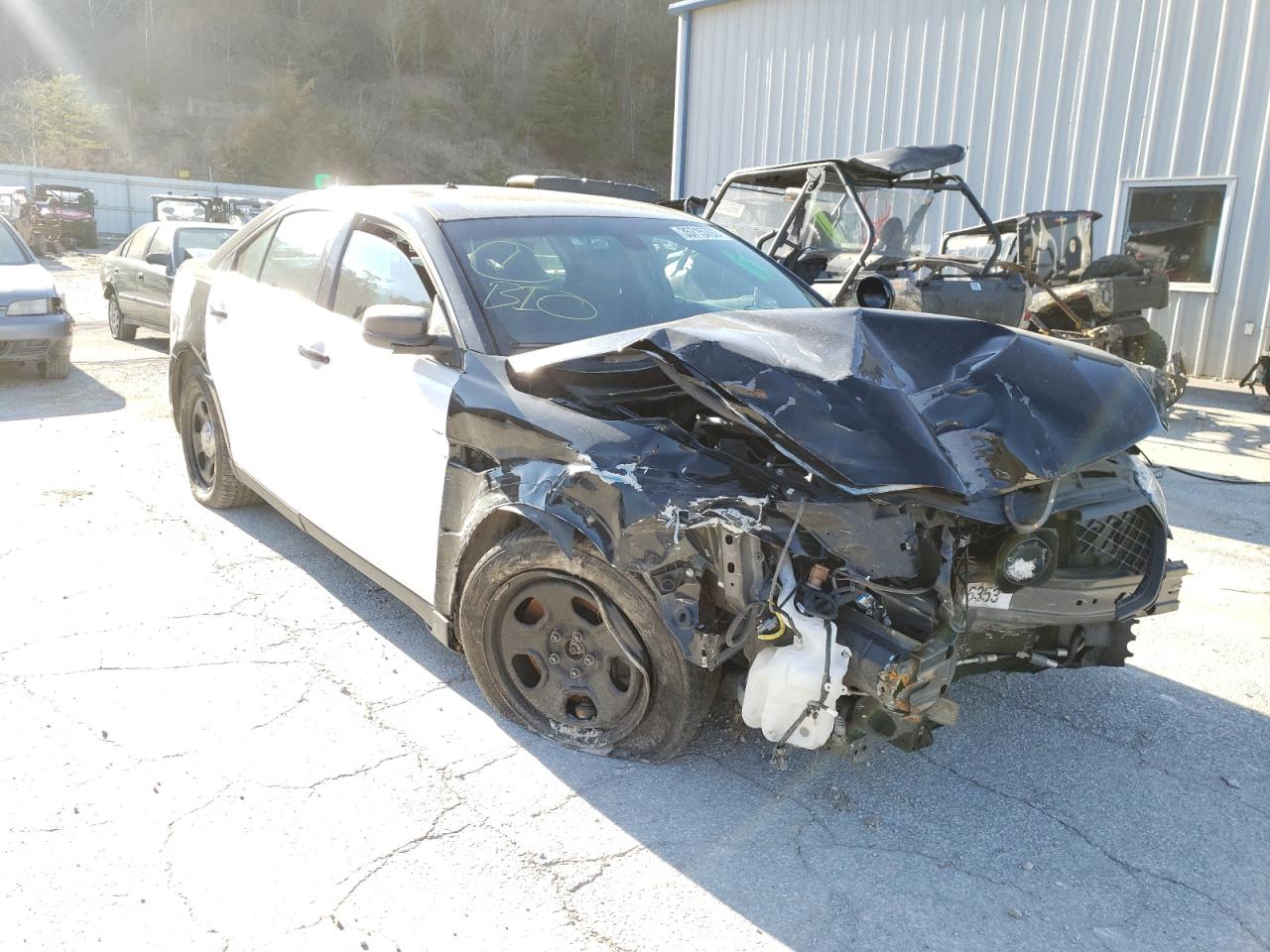 FORD TAURUS POL 2014 with VIN 1FAHP2MK2EG111921 - Photo from auction