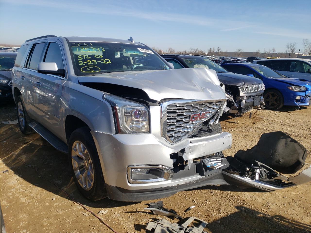 GMC YUKON SLT 2015 with VIN 1GKS2BKC9FR690393 - Photo from auction