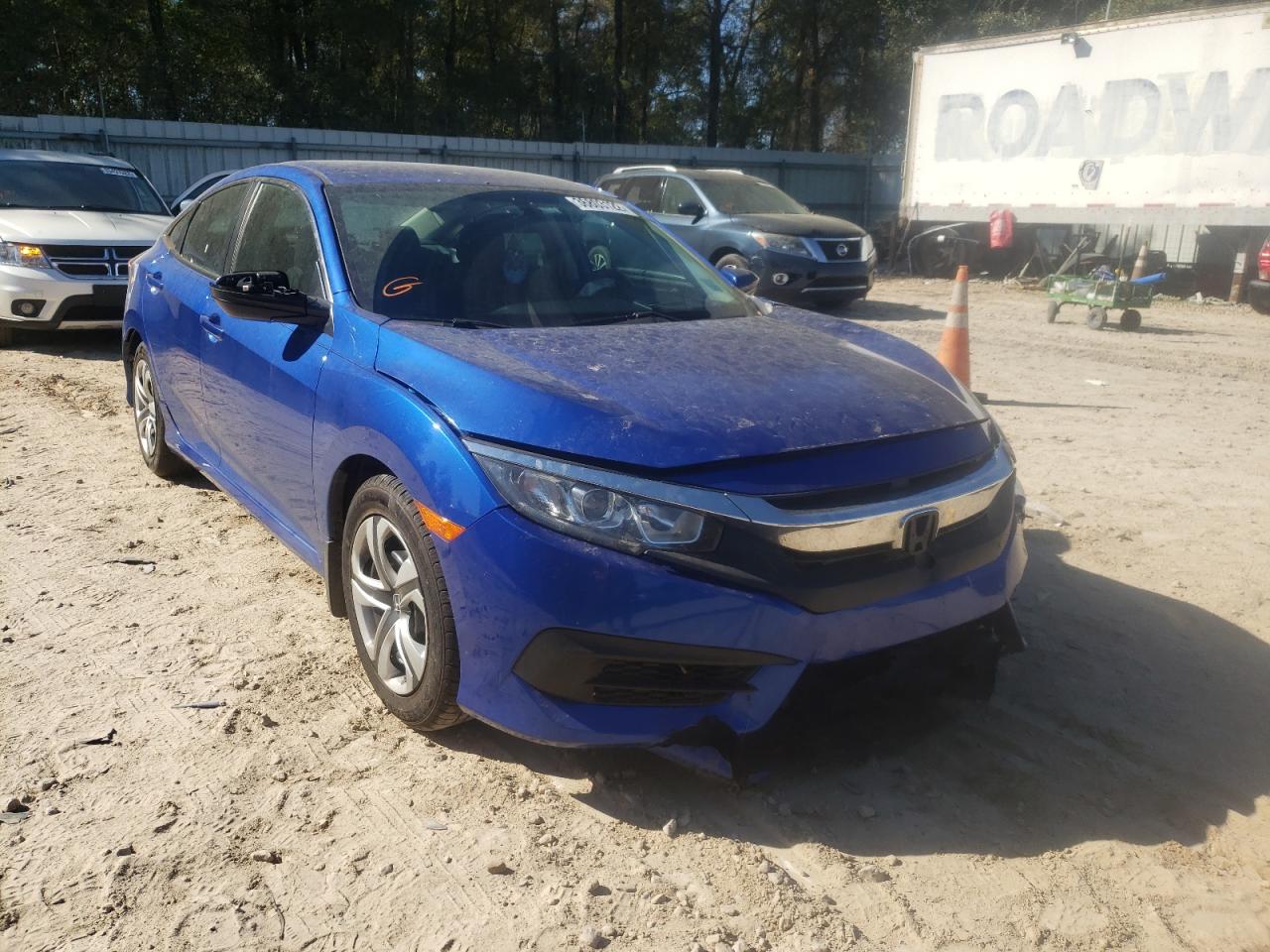 HONDA CIVIC LX 2018 with VIN 19XFC2F55JE021564 - Photo from auction