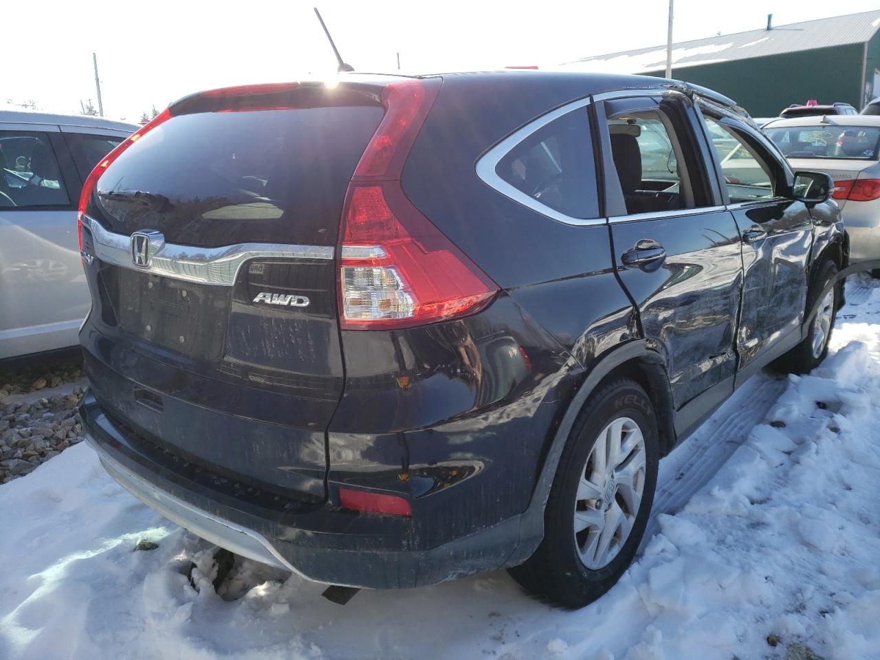 Photo 4 from auction – 2015 HONDA CR-V EX with VIN 2HKRM4H58FH652055