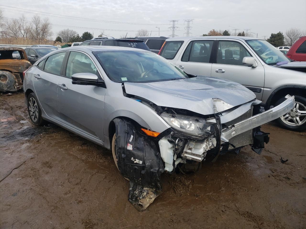 HONDA CIVIC EX 2018 with VIN 2HGFC2F70JH595156 - Photo from auction