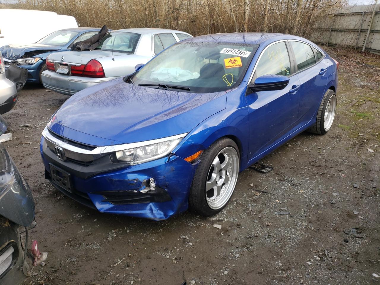 Photo 2 from auction – 2016 HONDA CIVIC LX with VIN 19XFC2F52GE234125