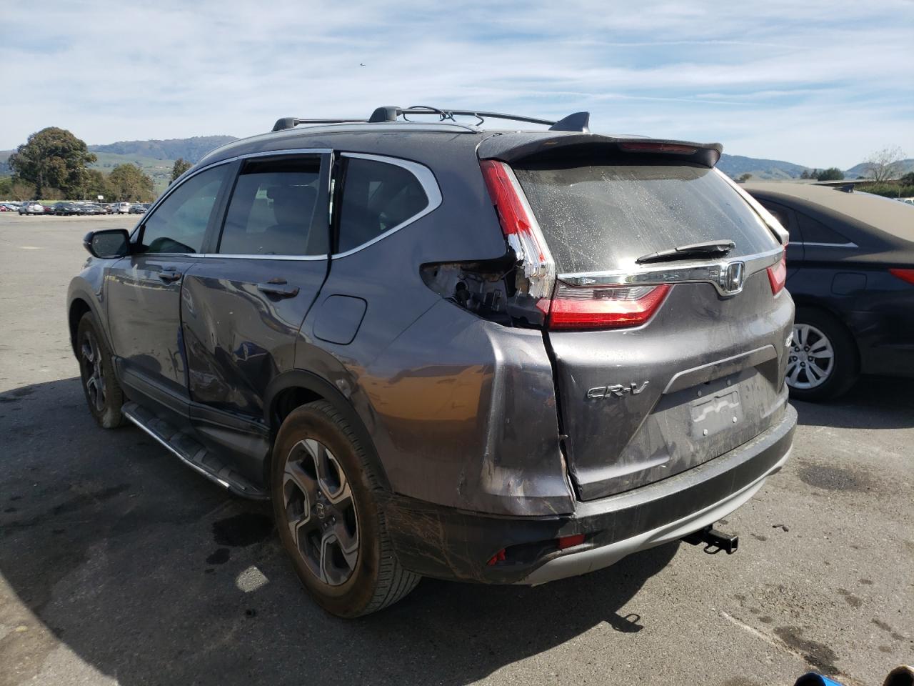 Photo 3 from auction – 2018 HONDA CR-V EXL with VIN 7FARW2H89JE024011