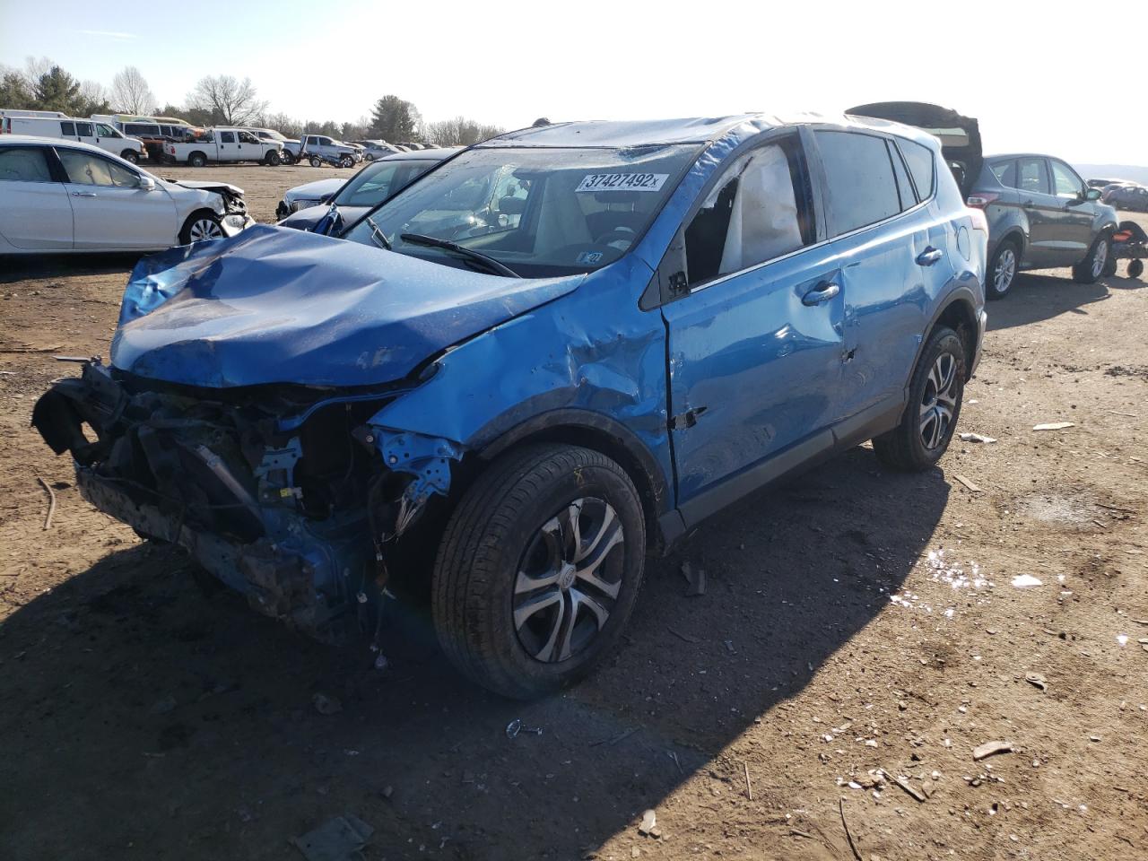 Photo 2 from auction – 2018 TOYOTA RAV4 LE with VIN JTMBFREV2JJ227444