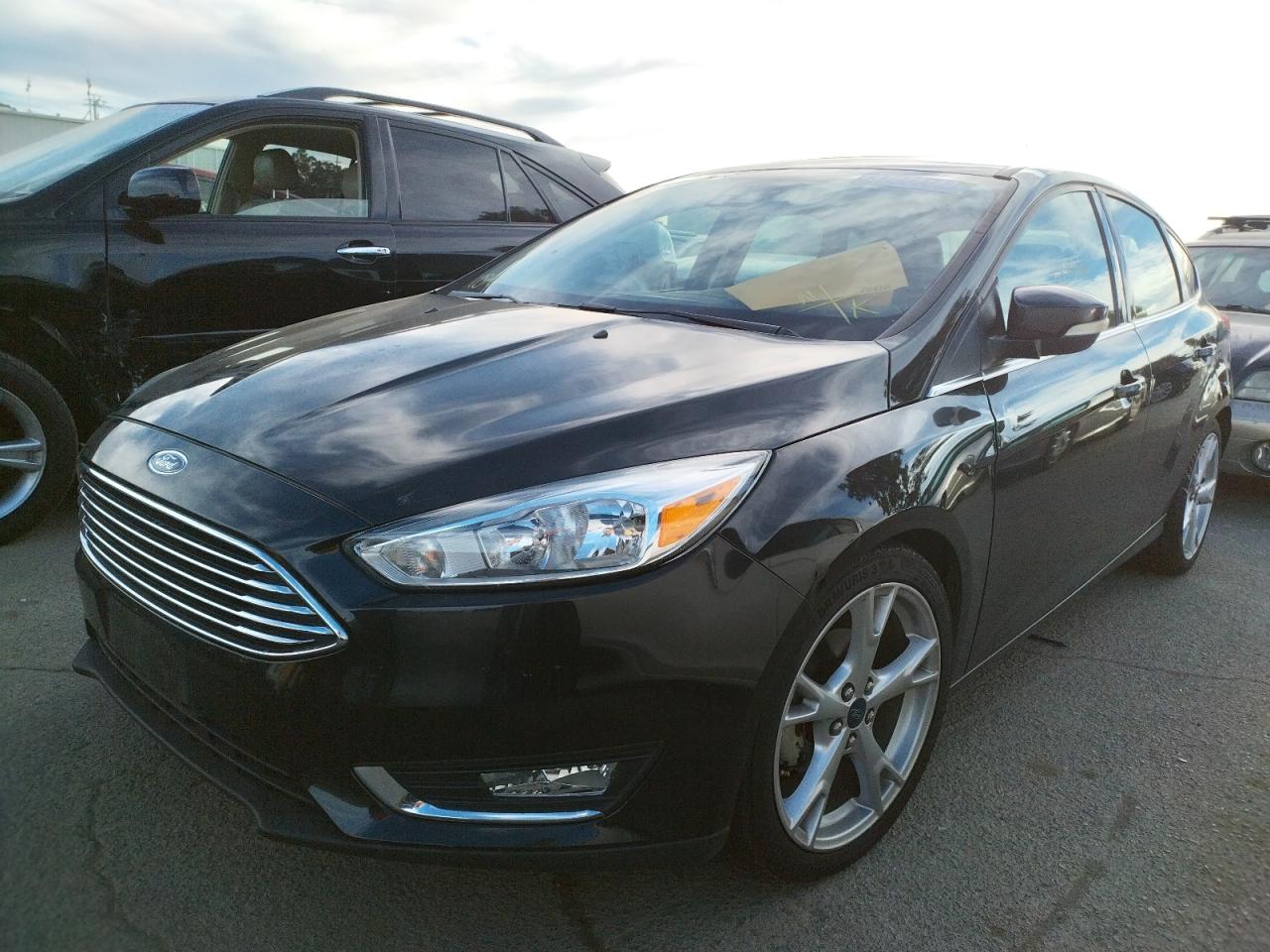 Photo 2 from auction – 2015 FORD FOCUS TITA with VIN 1FADP3N2XFL306760