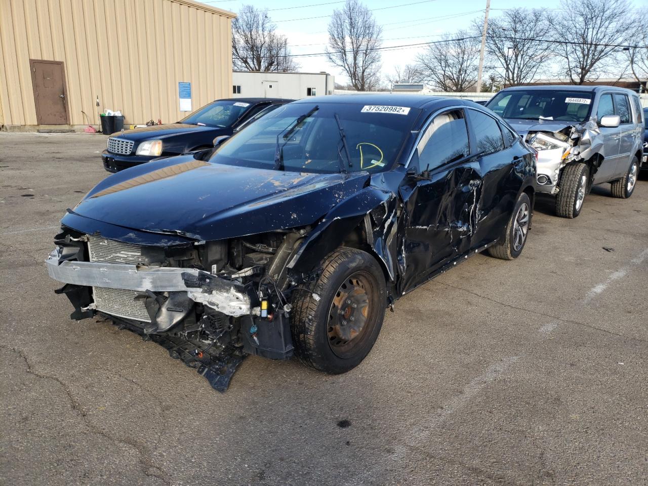 Photo 2 from auction – 2019 HONDA CIVIC LX with VIN 19XFC2F62KE011083