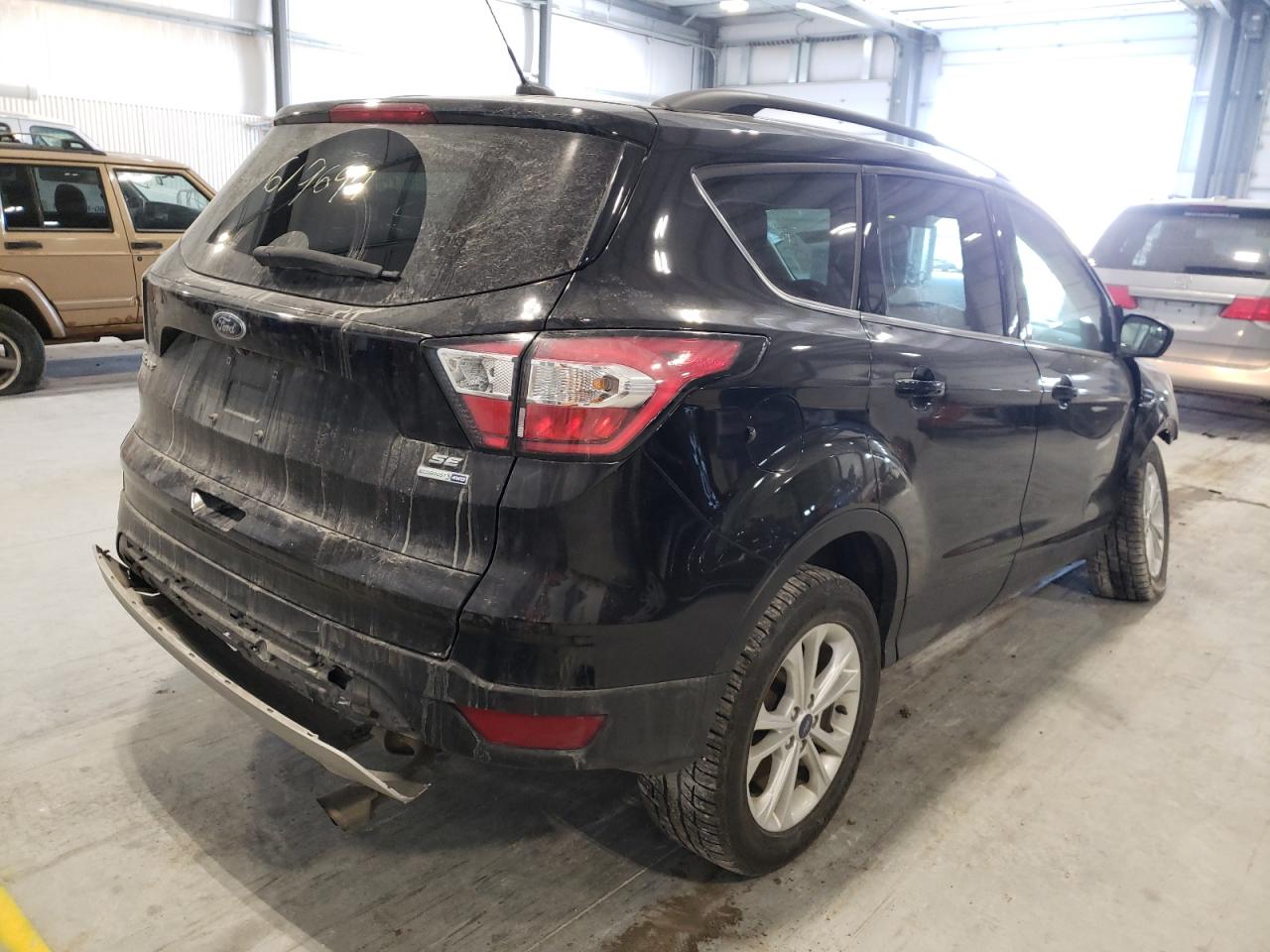 Photo 4 from auction – 2018 FORD ESCAPE SE with VIN 1FMCU9G92JUB48800