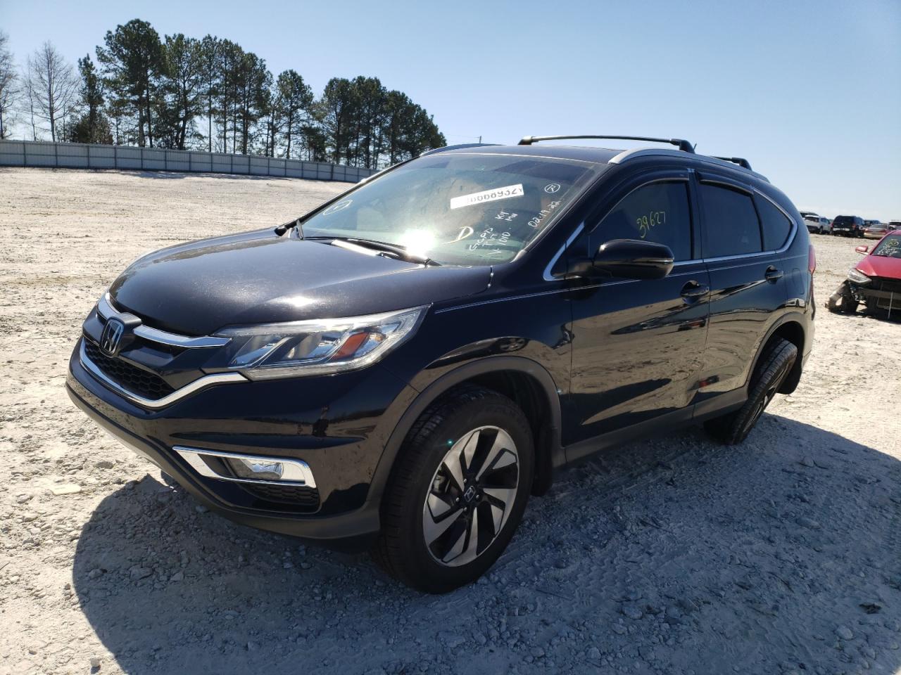Photo 2 from auction – 2015 HONDA CR-V TOURI with VIN 5J6RM4H94FL121010