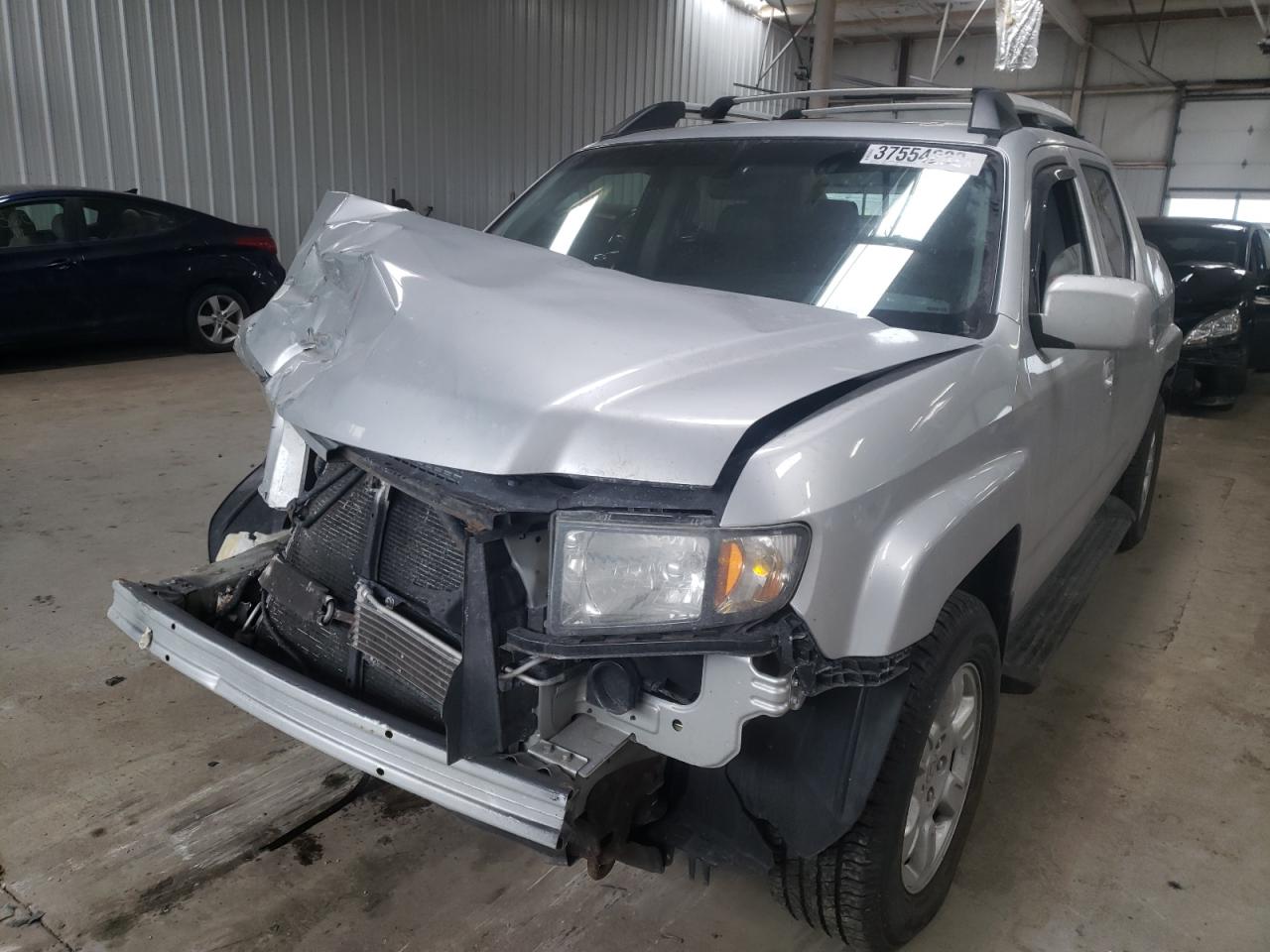 Photo 2 from auction – 2006 HONDA RIDGELINE with VIN 2HJYK16596H571556